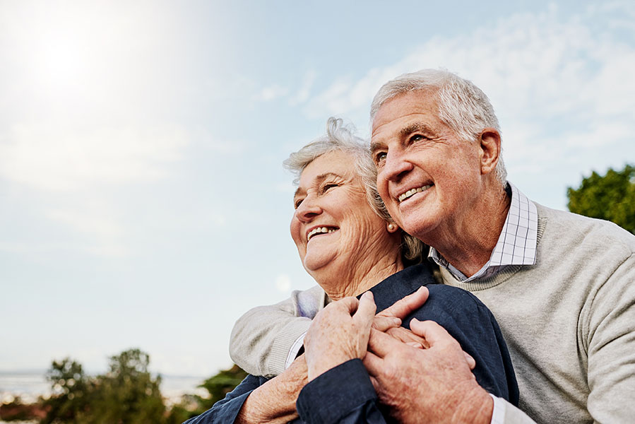 Sky, elderly couple and hug outdoors or happy in retirement or h