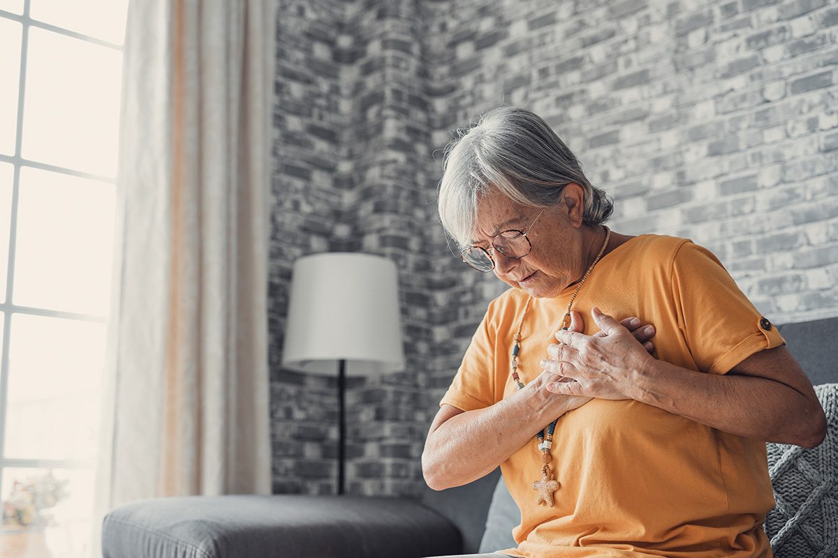 Upset stressed mature middle aged woman feeling pain ache touchi